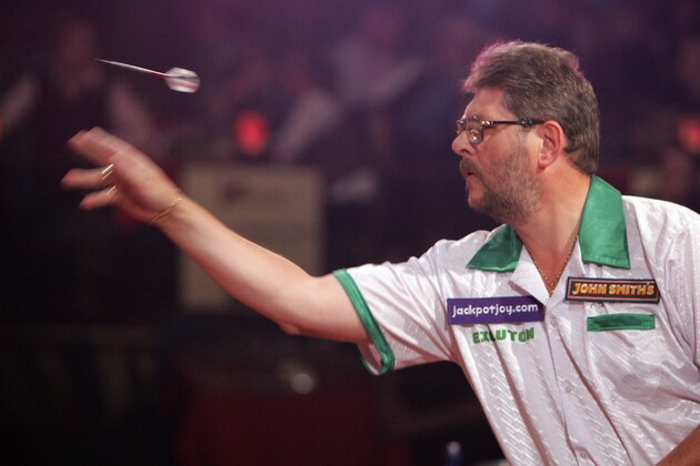 England's Martin Adams throws a dart during his second round match in the World Professional Darts Championships against England's Martin Atkins at the Lakeside Country Club, Frimley Green, England, Wednesday Jan. 11, 2006. (AP Photo/Tom Hevezi)
