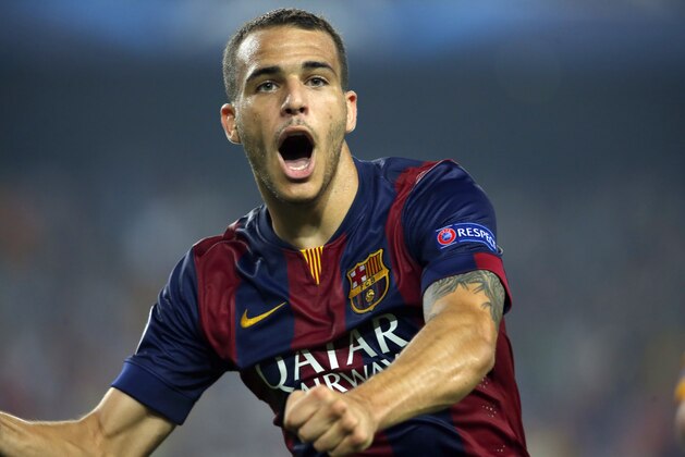 Barcelona's Sandro Ramirez celebrates after scoring his side's 3rd goal during the Champions League group F soccer match between F.C. Barcelona and Ajax at Camp Nou stadium in Barcelona, Spain, Tuesday, Oct. 21, 2014. Barcelona defeated Ajax 3-1. (AP Photo/Emilio Morenatti)