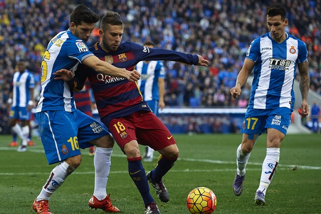 BARCELONA, SPAIN - JANUARY 02:  Javi Lopez (L) of Espanyol competes for the ball with Jordi Alba of Barcelona during the La Liga match between Real CD Espanyol and FC Barcelona at Cornella-El Prat Stadium on January 2, 2016 in Barcelona, Spain.  (Photo by Manuel Queimadelos Alonso/Getty Images)