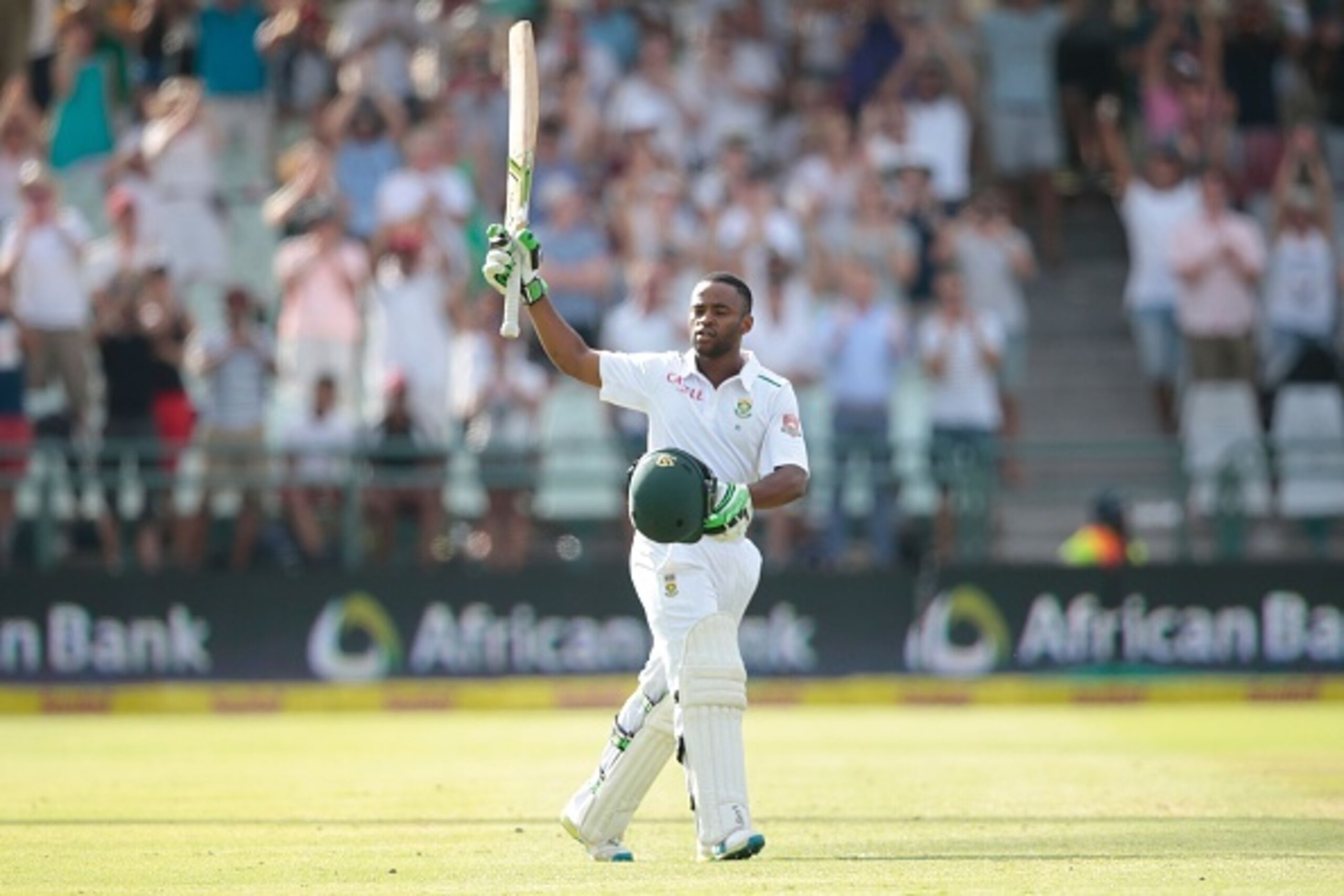 South African batsman Temba Bavuma celebrates after scoring a century (100  runs) during day 4 of the second Test match between England and South Africa at the Newlands stadium on January 5, 2016 in Cape Town, South Africa. / AFP / GIANLUIGI GUERCIA        (Photo credit should read GIANLUIGI GUERCIA/AFP/Getty Images)