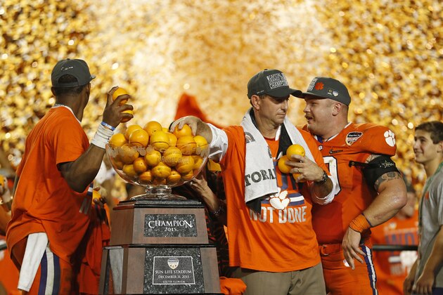 MIAMI GARDENS, FL - DECEMBER 31: Head coach Dabo Swinney of the Clemson Tigers takes oranges out of the trophy as he celebrates the win against the Oklahoma Sooners during the 2015 Capital One Orange Bowl at Sun Life Stadium on December 29, 2015 in Miami Gardens, Florida. Clemson defeated Oklahoma 37-17. (Photo by Joel Auerbach/Getty Images)