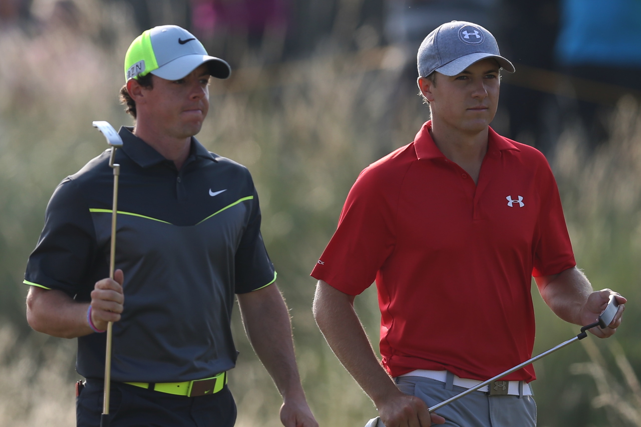 Rory McIlroy of Northern Ireland, left, and Jordan Spieth of the US walk up to the 14th tee box during the second day of the British Open Golf championship at the Royal Liverpool golf club, Hoylake, England, Friday July 18, 2014. (AP Photo/Scott Heppell)
