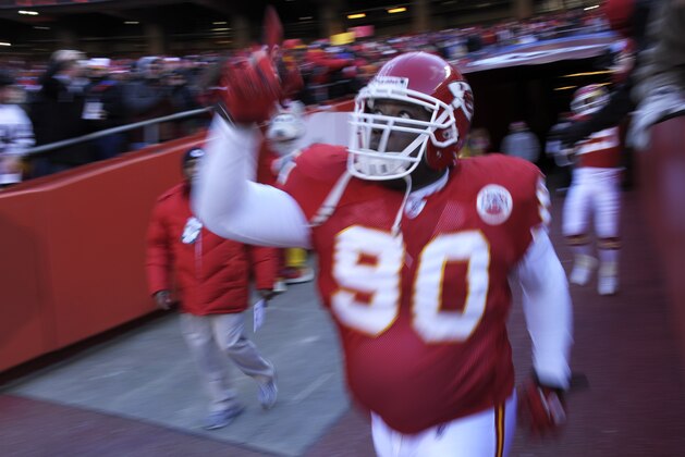 Kansas City Chiefs defensive tackle Shaun Smith (90) points to the sky as he runs onto the field for their start of their NFL football game against the Oakland Raiders in Kansas City, Mo., Sunday, Jan. 2, 2011. (AP Photo/Reed Hoffmann)