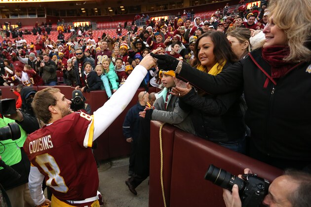 LANDOVER, MD - DECEMBER 20: Quarterback Kirk Cousins #8 of the Washington Redskins celebrates with fans after the Washington Redskins defeated the Buffalo Bills 35-25 at FedExField on December 20, 2015 in Landover, Maryland. (Photo by Matt Hazlett/Getty Images)