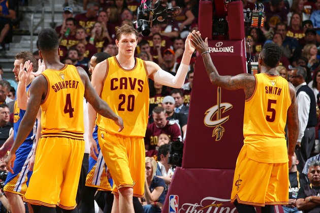 CLEVELAND, OH - JUNE 11:  Teammates Iman Shumpert #4, Timofey Mozgov #20, and J.R. Smith #5 of the Cleveland Cavaliers high-five during Game Four of the 2015 NBA Finals at The Quicken Loans Arena on June 11, 2015 in Cleveland, Ohio. NOTE TO USER: User expressly acknowledges and agrees that, by downloading and/or using this Photograph, user is consenting to the terms and conditions of the Getty Images License Agreement. Mandatory Copyright Notice: Copyright 2015 NBAE (Photo by Nathaniel S. Butler/NBAE via Getty Images)