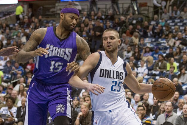 Jan 5, 2016; Dallas, TX, USA; Dallas Mavericks forward Chandler Parsons (25) dribbles the ball past Sacramento Kings forward DeMarcus Cousins (15) during the first quarter at the American Airlines Center. Mandatory Credit: Jerome Miron-USA TODAY Sports