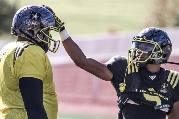 Wide receiver/athlete Demetris Robertson (right) congratulates defensive tackle Dexter Lawrence on a play during U.S. Army All-American Bowl practice. Both Lawrence and Robertson, two 5-star athletes, performed well Tuesday.