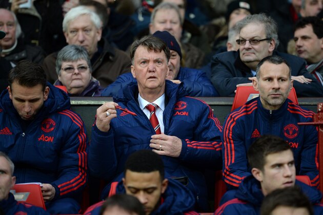 Manchester United's Dutch manager Louis van Gaal (C) and Manchester United's Welsh assistant manager Ryan Giggs (centre right) prepare to watch the English Premier League football match between Manchester United and Swansea City at Old Trafford in Manchester, north west England, on January 2, 2016. Manchester United won the game 2-1. AFP PHOTO / OLI SCARFF

RESTRICTED TO EDITORIAL USE. No use with unauthorized audio, video, data, fixture lists, club/league logos or 'live' services. Online in-match use limited to 75 images, no video emulation. No use in betting, games or single club/league/player publications. / AFP / OLI SCARFF        (Photo credit should read OLI SCARFF/AFP/Getty Images)