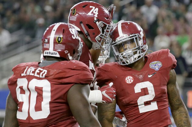 After scoring a touchdown against Michigan State, Alabama running back Derrick Henry (2) celebrates with offensive lineman Cam Robinson (74) and defensive lineman Jarran Reed (90) during the first half of the Cotton Bowl NCAA college football semifinal playoff game, Thursday, Dec. 31, 2015, in Arlington, Texas. (AP Photo/LM Otero)