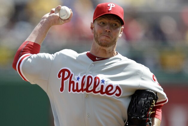 Philadelphia Phillies pitcher Roy Halladay throws during the first inning of the season opening baseball game against the Pittsburgh Pirates in Pittsburgh Thursday, April 5, 2012. (AP Photo/Gene J. Puskar)