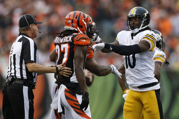 Pittsburgh Steelers wide receiver Martavis Bryant (10) shoves Cincinnati Bengals cornerback Dre Kirkpatrick (27) in the second half of an NFL football game, Sunday, Dec. 13, 2015, in Cincinnati. (AP Photo/Gary Landers)