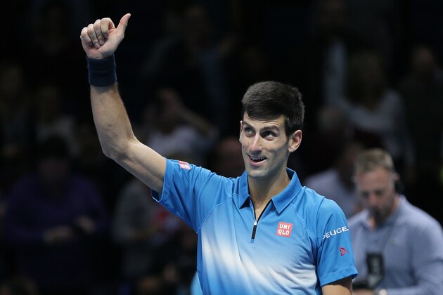 Novak Djokovic of Serbia celebrates winning match point from Roger Federer of Switzerland during their ATP World Tour Finals final tennis match at the O2 Arena in London, Sunday Nov. 22, 2015. (AP Photo/Tim Ireland)