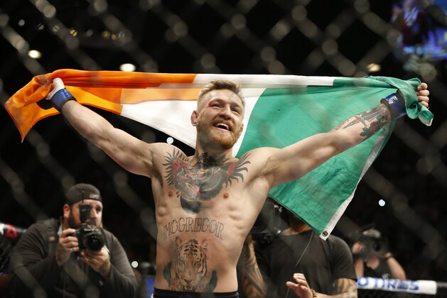 Conor McGregor reacts after defeating Jose Aldo during a featherweight championship mixed martial arts bout at UFC 194, Saturday, Dec. 12, 2015, in Las Vegas. (AP Photo/John Locher)