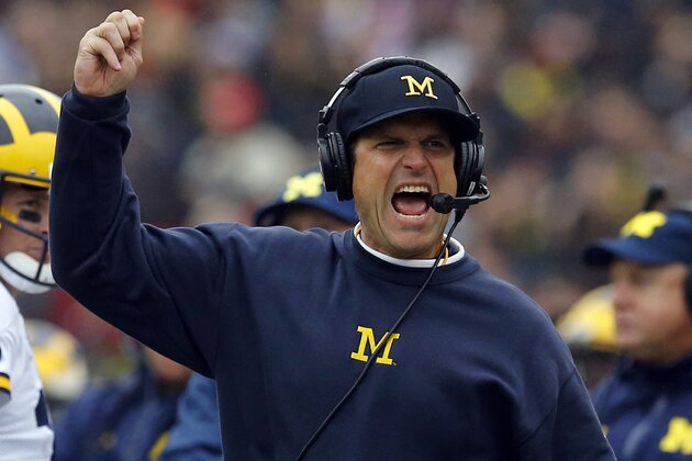 FILE - In this Oct. 3, 2015, file photo, Michigan head coach Jim Harbaugh calls for a flag in the first half of an NCAA college football game against Maryland in College Park, Md. Michigan and Florida both entered the season hoping to revive storied programs that had begun to look more pedestrian than they were accustomed to. Enter Wolverines coach Harbaugh and Gators coach Jim McElwain, who both brought their own style and approach to the sidelines in their first seasons on the job. (AP Photo/Patrick Semansky, File)