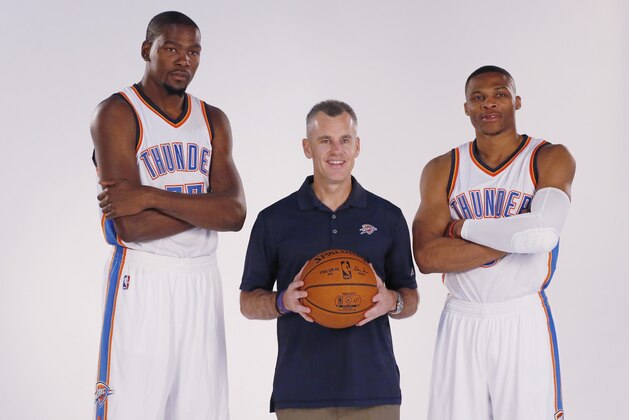 Oklahoma City Thunder head coach Billy Donovan, center, poses with forward Kevin Durant, left, and guard Russell Westbrook right, during media day in Oklahoma City, Monday, Sept. 28, 2015. (AP Photo/Sue Ogrocki)