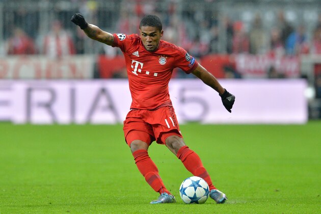 Bayern's Douglas Costa during the Champions League group F soccer match between FC Bayern Munich and Olympiakos in Munich, Germany, Tuesday, Nov. 24, 2015. (AP Photo/Kerstin Joensson)