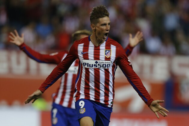 Atletico Madrid's Fernando Torres celebrates after scoring the opening goal against Barcelona during a Spanish La Liga soccer match between Atletico Madrid and Barcelona at the Vicente Calderon stadium in Madrid, Saturday, Sept. 12, 2015. (AP Photo/Francisco Seco)