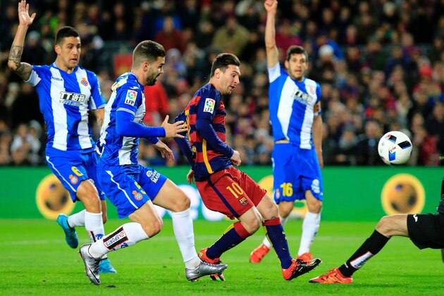 Barcelona's Argentinian forward Lionel Messi (C) tries to score past Espanyol's Spanish goalkeeper Pau Lopez during the Spanish Copa del Rey (King's Cup) round of 16 first leg football match FC Barcelona vs RCD Espanyol at the Camp Nou stadium in Barcelona on January 6, 2016.   AFP PHOTO/ PAU BARRENA / AFP / PAU BARRENA        (Photo credit should read PAU BARRENA/AFP/Getty Images)