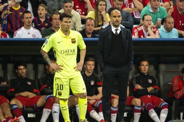 Barcelona's Argentinian forward Lionel Messi (L) and Bayern Munich's Spanish head coach Pep Guardiola stand on the pitch during the UEFA Champions League football match semi final FC Bayern Munich vs FC Barcelona in Munich on May 12, 2015.  
AFP PHOTO / ODD ANDERSEN        (Photo credit should read ODD ANDERSEN/AFP/Getty Images)