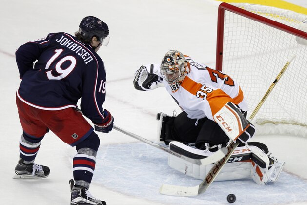 Philadelphia Flyers' Steve Mason makes a stop against Columbus Blue Jackets' Ryan Johansen in a shootout during an NHL hockey game in Columbus, Ohio, Saturday, Dec. 19, 2015. The Blue Jackets won 3-2. (AP Photo/Paul Vernon)