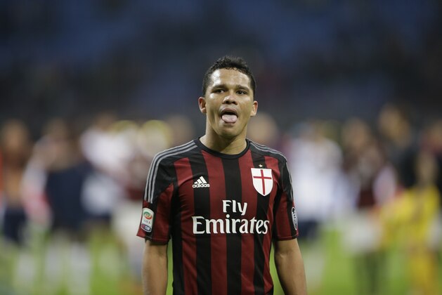 AC Milan's Carlos Bacca grimaces at the end of a Serie A soccer match between AC Milan and Bologna, at the San Siro stadium in Milan, Italy, Wednesday Jan. 6, 2016. Bologna won 1-0. (AP Photo/Luca Bruno)