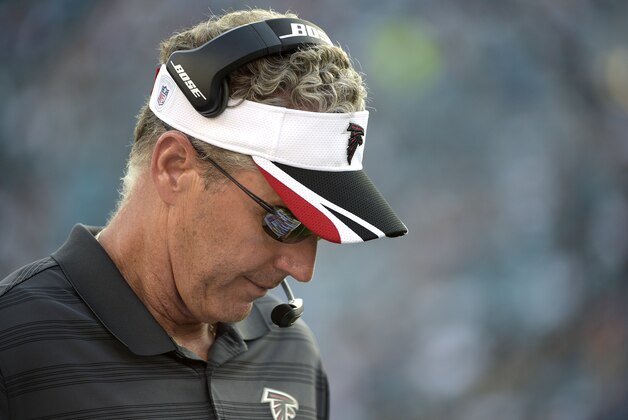 Atlanta Falcons offensive coordinator Dirk Koetter walks along the sideline during the first half of an NFL preseason football game against the Jacksonville Jaguars in Jacksonville, Fla., Thursday, Aug. 28, 2014.(AP Photo/Phelan M. Ebenhack)