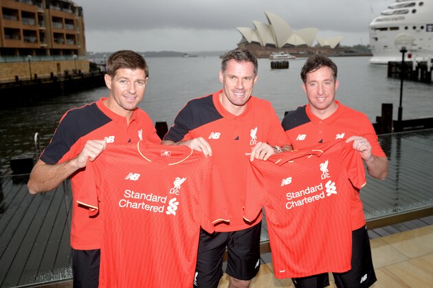 Former Liverpool football stars Steven Gerrard (L) Jamie Carragher (C) and Robbie Fowler (R) hold up Liverpool shirts in front of Sydney Harbour in Sydney on January 6, 2016.  Gerrard will pull on the famous Reds shirt once again when he plays for the club's 'Legends' side against Australia Legends in Sydney on January 7, 2016. AFP PHOTO / Peter PARKS  IMAGE STRICTLY FOR EDITORIAL USE - STRICTLY NO COMMERCIAL USE / AFP / PETER PARKS        (Photo credit should read PETER PARKS/AFP/Getty Images)