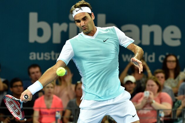 Tournament top seed Roger Federer of Switzerland hits a return against Tobias Kamke of Germany during their men's singles match on the fifth day of the Brisbane International tennis tournament on January 7, 2016. AFP PHOTO / Saeed KHAN
-- IMAGE RESTRICTED TO EDITORIAL USE - STRICTLY NO COMMERCIAL USE / AFP / SAEED KHAN        (Photo credit should read SAEED KHAN/AFP/Getty Images)