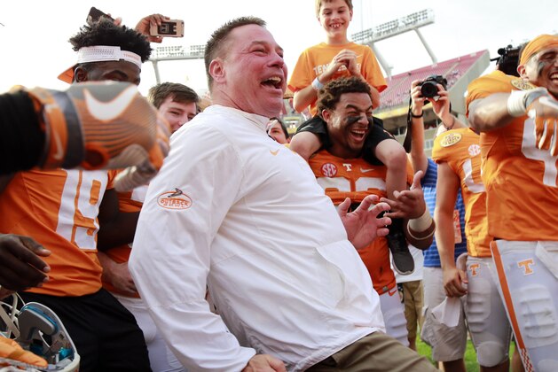 Jan 1, 2016; Tampa, FL, USA; Tennessee Volunteers head coach Butch Jones and  his team celebrate as they beat the Northwestern Wildcats in the 2016 Outback Bowl at Raymond James Stadium. Tennessee Volunteers defeated the Northwestern Wildcats 45-6. Tennessee Volunteers Mandatory Credit: Kim Klement-USA TODAY Sports