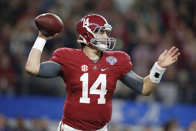 Dec 31, 2015; Arlington, TX, USA; Alabama Crimson Tide quarterback Jake Coker (14) drops back to pass against the Michigan State Spartans in the first quarter in the 2015 CFP semifinal at the Cotton Bowl at AT&T Stadium. Mandatory Credit: Tim Heitman-USA TODAY Sports