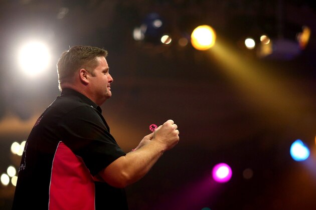 FRIMLEY, ENGLAND - JANUARY 11: Scott Mitchell of England celebrates winning the mens final against Martin Adams of England during the BDO Lakeside World Professional Darts Championships on Day Nine at The Lakeside Country Club on January 11, 2015 in Frimley, England. (Photo by Charlie Crowhurst/Getty Images)
