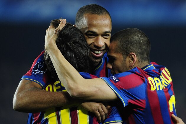 FC Barcelona's Lionel Messi of Argentina reacts after scoring, left, with his teammates Thierry Henry, from France, center, and Daniel Alves, from Brazil, right, against VfB Stuttgart during a Champions League soccer match at the Camp Nou stadium in Barcelona, Spain, Wednesday, March 17, 2010. (AP Photo/Manu Fernandez)