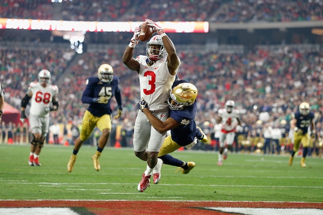 GLENDALE, AZ - JANUARY 01:  Wide receiver Michael Thomas #3 of the Ohio State Buckeyes hauls cornerback Nick Watkins #21 of the Notre Dame Fighting Irish into the end zone for a first quarter touchdown during the BattleFrog Fiesta Bowl at University of Phoenix Stadium on January 1, 2016 in Glendale, Arizona.  (Photo by Christian Petersen/Getty Images)