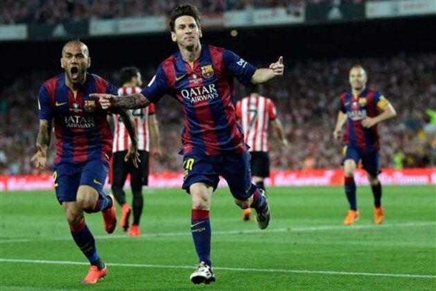 FILE - In this Saturday, May 30, 2015 file photo, Barcelona's Lionel Messi, centre,  celebrates after scoring the opening goal during the final of the Copa del Rey soccer match between FC Barcelona and Athletic Bilbao at the Camp Nou stadium in Barcelona, Spain. Carli Lloyd and Lionel Messi are among the nominees for the FIFA Puskas Award for goal of the year. Lloyd scored for the United States from 50 yards against Japan in the Women’s World Cup final. Messi beat four defenders before scoring Barcelona’s first goal against Athletic Bilbao in the Copa del Rey final. (AP Photo/Manu Fernandez, File)