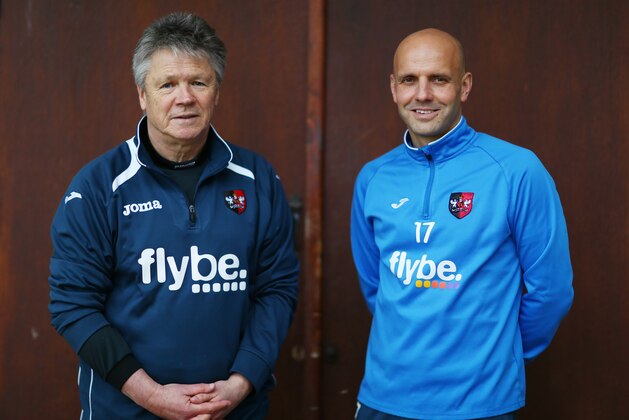 EXETER, ENGLAND - JANUARY 06:  (L-R) Steve Perryman the Exeter City Director of Football and Paul Tisdale the Manager of Exeter City pose during the Exeter City FA Cup Media Day at the Cliff Hill training ground on January 6, 2016 in Exeter, England.  (Photo by Michael Steele/Getty Images)