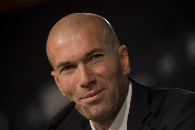 Real Madrid's newly appointed coach Zinedine Zidane pauses during his first press conference at the Santiago Bernabeu stadium in Madrid, Spain, Tuesday Jan. 5, 2016. Real Madrid fired coach Rafael Benitez Monday after seven months and replaced him with former player Zinedine Zidane a day after Madrid's 2-2 draw at Valencia deepened a crisis that started with an embarrassing 4-0 home loss to rival Barcelona in November. (AP Photo/Paul White)