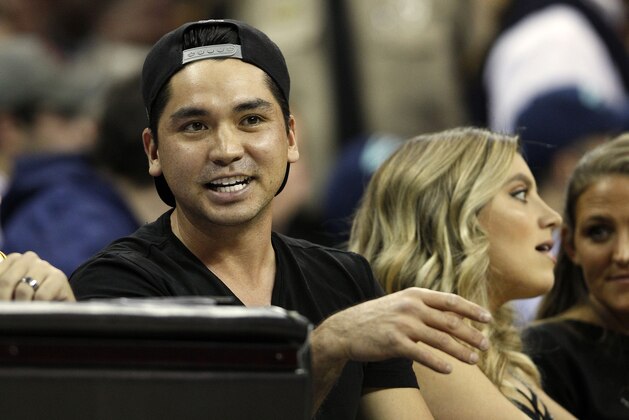 CLEVELAND, OH - DECEMBER 17:  Professional Golfer Jason Day sits with his wife Ellie Day during the second half of the NBA game between the Cleveland Cavaliers and the Oklahoma City Thunder on December 17, 2015 at Quicken Loans Arena  in Cleveland, Ohio.  Ellie was injured a few moments later when LeBron James #23 (not pictured) hit her when he fell into the stands.  The Cavaliers defeated the Thunder 104-100.  NOTE TO USER: User expressly acknowledges and agrees that, by downloading and or using this photograph, User is consenting to the terms and conditions of the Getty Images License Agreement. (Photo by David Maxwell/Getty Images)