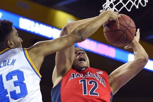 Arizona forward Ryan Anderson, right, shoots as UCLA guard Jonah Bolden defends during the first half of an NCAA college basketball game Thursday, Jan. 7, 2016, in Los Angeles. (AP Photo/Mark J. Terrill)