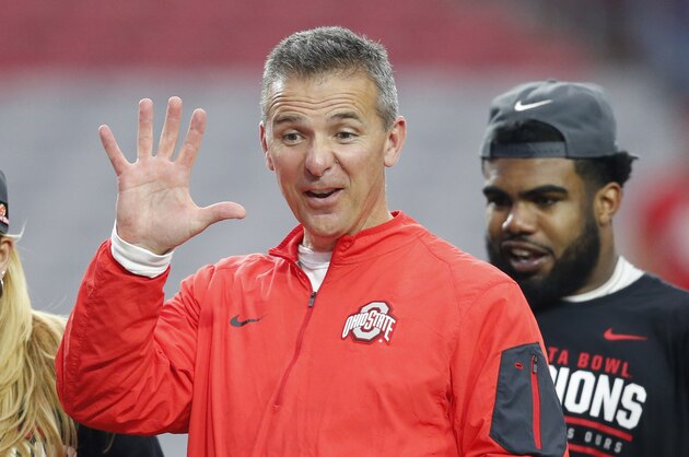 Ohio State head coach Urban Meyer waves after the Fiesta Bowl NCAA College football game against Notre Dame, Friday, Jan. 1, 2016, in Glendale, Ariz. Ohio State won 44-28. (AP Photo/Ross D. Franklin)