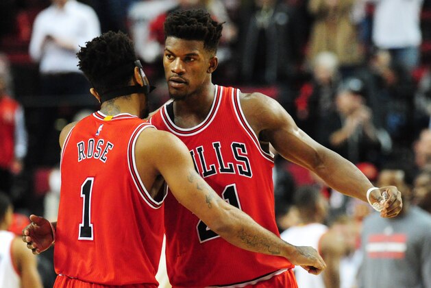 Chicago Bulls guard Derrick Rose (1) and guard Jimmy Butler (21) celebrate after the NBA basketball game against the Portland Trail Blazers in Portland, Ore., Tuesday, Nov. 24, 2015. The Bulls won the game 93-88. (AP Photo/Steve Dykes)