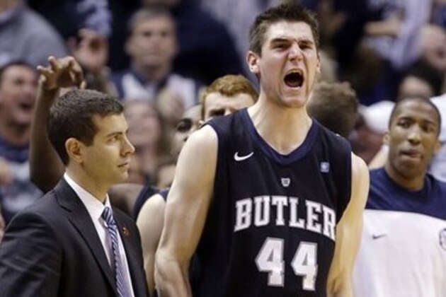 Butler center Andrew Smith (44) celebrates next to head coach Brad Stevens during the overtime period an NCAA college basketball game against Indiana in Indianapolis, Saturday, Dec. 15, 2012. Butler defeated No. 1 Indiana 88-86 in overtime. (AP Photo/Michael Conroy)