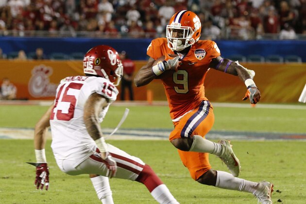 Clemson running back Wayne Gallman (9) carries the ball as Oklahoma cornerback Zack Sanchez (15) attempts to defend, during the second half of the Orange Bowl NCAA college football semifinal playoff game, Thursday, Dec. 31, 2015, in Miami Gardens, Fla. Clemson defeated Oklahoma 37-17.  (AP Photo/Joe Skipper)