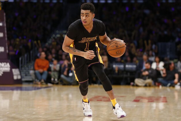 Los Angeles Lakers' D'Angelo Russell dribbles the ball against the Philadelphia 76ers during the second half of an NBA basketball game, Friday, Jan. 1, 2016, in Los Angeles. The Lakers won 93-84. (AP Photo/Danny Moloshok)