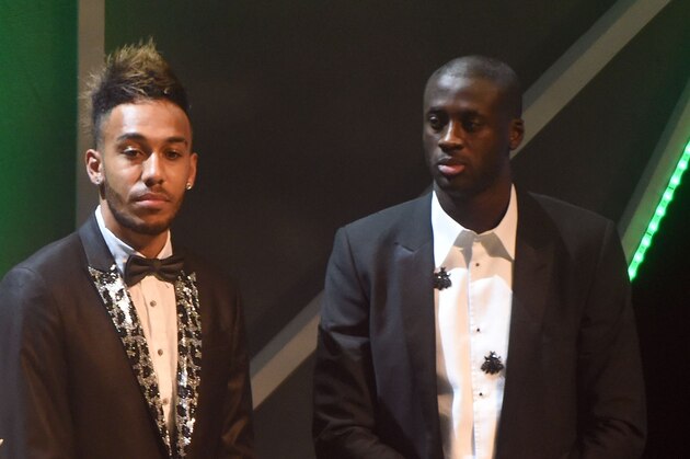 Gabonese striker Pierre-Emerick Aubameyang (C) flanked Ivorian striker Yaya Toure (R) and his Ghanaian counterpart Andre Ayew wait for verdict during the 2015 GLO-CAF African Footballer of the Year Award in Abuja, on December 7, 2016. AFP PHOTO/PIUS UTOMI EKPEI / AFP / PIUS UTOMI EKPEI        (Photo credit should read PIUS UTOMI EKPEI/AFP/Getty Images)