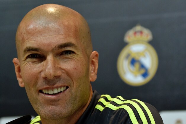 Real Madrid's new French coach Zinedine Zidane smiles during a press conference at the Valdebebas training ground in Madrid on January 8, 2016.   AFP PHOTO / GERARD JULIEN / AFP / GERARD JULIEN        (Photo credit should read GERARD JULIEN/AFP/Getty Images)