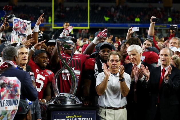 ARLINGTON, TX - DECEMBER 31:  Head coach Nick Saban of the Alabama Crimson Tide celebrates with the trophy after defeating the Spartans 38 to 0 in the Goodyear Cotton Bowl at AT&T Stadium on December 31, 2015 in Arlington, Texas.  (Photo by Tom Pennington/Getty Images)
