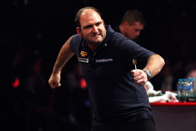 FRIMLEY, ENGLAND - JANUARY 12: Scott Waites of England celebrates winning his semi final match against Richie George of England on day eight of the BDO Lakeside World Professional Darts Championships at the Lakeside Country Club on January 12, 2013 in Frimley, England. (Photo by Ben Hoskins/Getty Images)