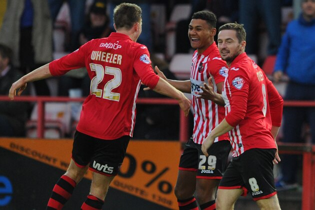 EXETER, ENGLAND - DECEMBER 6: Ollie Watkins of Exeter City(C) celebrates after scoring his sides second goal during the Emirates FA Cup Second Round match between Exeter City and Port Vale at St James Park on December 6, 2015 in Exeter England.  (Photo by Harry Trump/Getty Images)