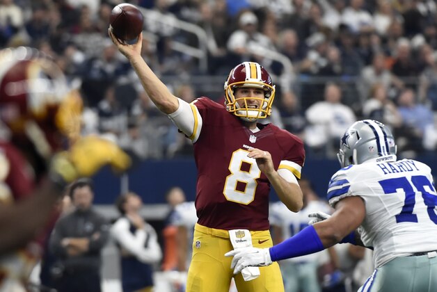 Washington Redskins quarterback Kirk Cousins (8) looks to throw a pass under pressure from Dallas Cowboys defensive end Greg Hardy (76) in the first half of an NFL football game, Sunday, Jan. 3, 2016, in Arlington, Texas. (AP Photo/Michael Ainsworth)