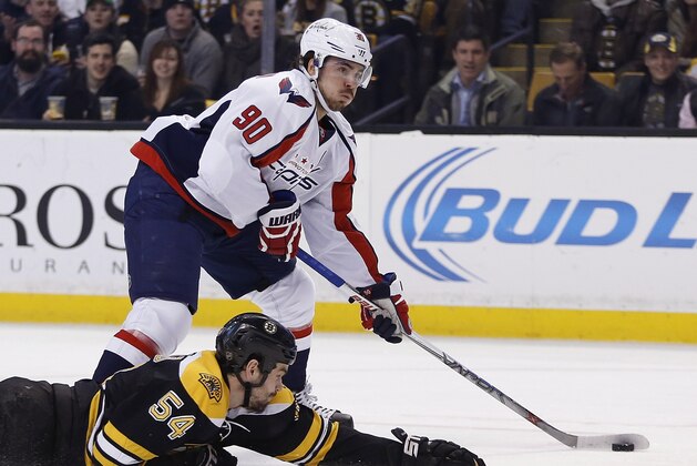 Boston Bruins' Adam McQuaid (54) defends against Washington Capitals' Marcus Johansson (90) during the first period of an NHL hockey game in Boston, Tuesday, Jan. 5, 2016. (AP Photo/Michael Dwyer)